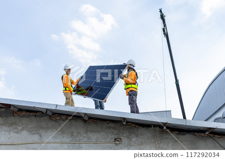 Technician worker on solar panels 117292034