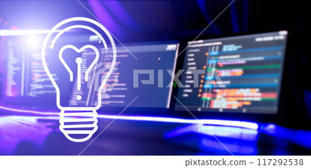 Creative glowing light bulb with computer program code on the screen. Technology and innovation concept. Creative glowing light bulb with computer program code on the screen. Technology and innovation concept. 117292538