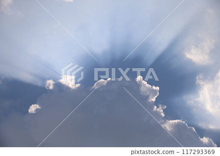 The sun peeking through the clouds The sun peeking through the clouds 117293369