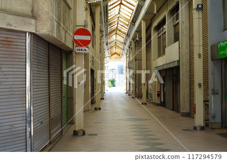 Shopping street with shutters Shopping street with shutters 117294579