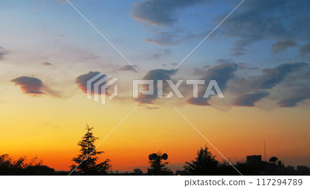 A sunset landscape with strange clouds 117294789