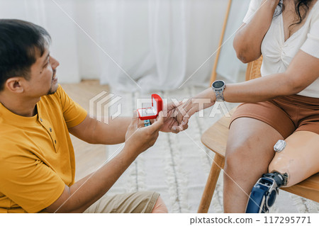 man making a proposal while giving an engagement ring 117295771