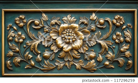 Ornate Golden Flower Carving on Green Wooden Panel 117296259
