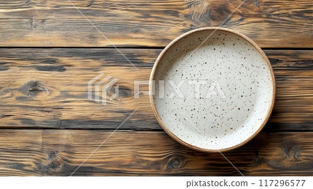 Ceramic Plate on Rustic Wooden Table 117296577