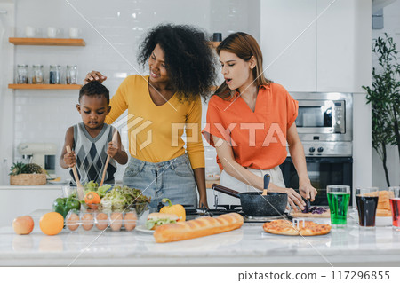 Pride LGBT Family at the kitchen Happy face. Happy smiling family having fun cooking at kitchen together 117296855