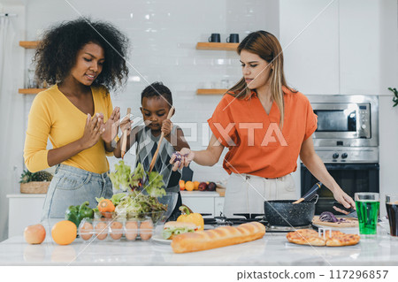 Pride LGBT Family at the kitchen Happy face. Happy smiling family having fun cooking at kitchen together Pride LGBT Family at the kitchen Happy face. Happy smiling family having fun cooking at kitchen together 117296857