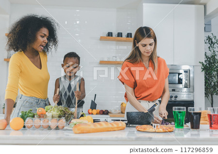 Pride LGBT Family at the kitchen Happy face. Happy smiling family having fun cooking at kitchen together 117296859
