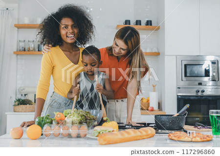 Pride LGBT Family at the kitchen Happy face. Happy smiling family having fun cooking at kitchen together 117296860