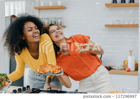Pride LGBT Family at the kitchen Happy face. Preparing family dinner at home 117296997