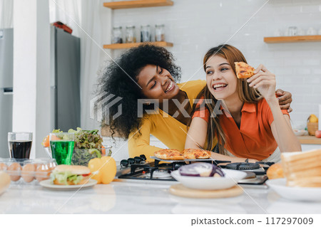 Pride LGBT Family at the kitchen Happy face. Preparing family dinner at home 117297009