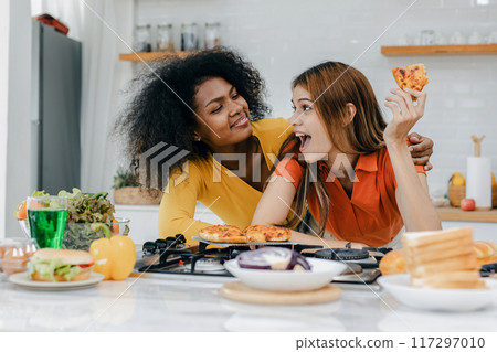 Pride LGBT Family at the kitchen Happy face. Preparing family dinner at home Pride LGBT Family at the kitchen Happy face. Preparing family dinner at home 117297010