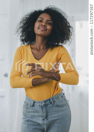 Portrait of African American woman with bushy curly hairstyle. young african american female 117297167
