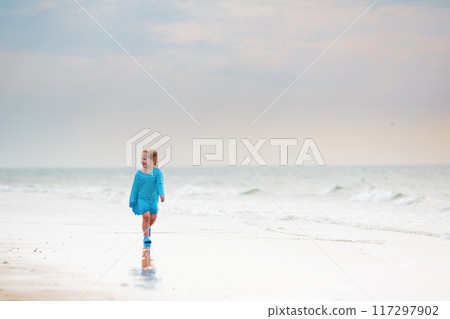 Kids playing on beach. Children play at sea. 117297902