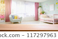 Empty wooden table with blurry baby room background, for design and decoration concepts 117297963