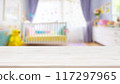 Empty wooden table with blurry baby room background, for design and decoration concepts 117297965