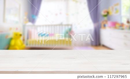 Empty wooden table with blurry baby room background, for design and decoration concepts Empty wooden table with blurry baby room background, for design and decoration concepts 117297965