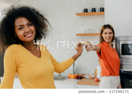 Happy smiling family having fun cooking at kitchen together Happy smiling family having fun cooking at kitchen together 117298171