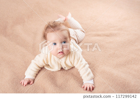 Little baby on white bed Little baby on white bed 117299142