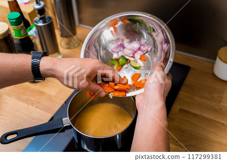 Chef at the kitchen preparing massaman curry with sweet potato and many spices 117299381