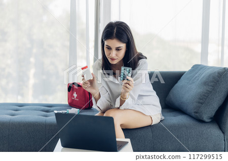 Woman sit down on sofa. healthcare virus protection. health and fever concept. Woman sit down on sofa. healthcare virus protection. health and fever concept. 117299515