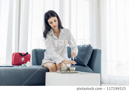 Woman Self healing perform first aid injury 117299525