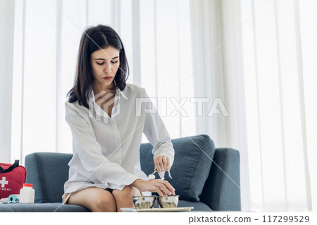 Woman Self healing perform first aid injury 117299529