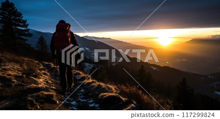 Silhouette of hiker enjoying the sunset over mountain landscape. Adventure and active lifestyle concept. Silhouette of hiker enjoying the sunset over mountain landscape. Adventure and active lifestyle concept. 117299824