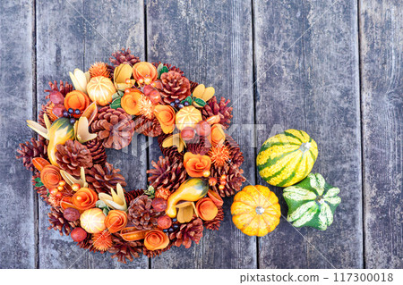 Halloween pumpkins on a wooden deck 117300018