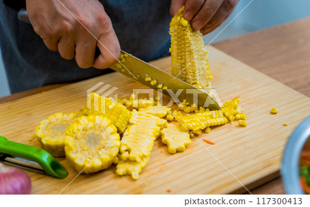 Chef at the kitchen preparing spicy glass noodle salad 117300413