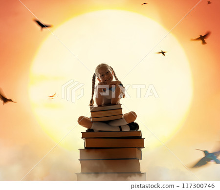 child on the tower of books 117300746