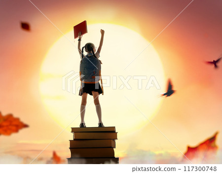 child on the tower of books child on the tower of books 117300748