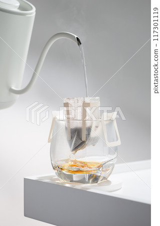 Drip bag brews coffee meticulously. 117301119