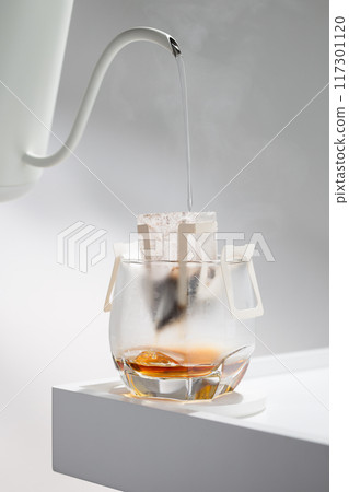 Drip bag brews coffee meticulously. 117301120