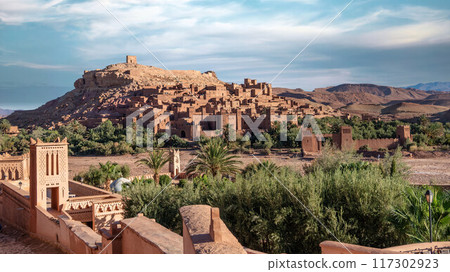 Ait Ben Haddou, an ancient fortified village in Morocco with mud-brick architecture and narrow streets, once a key stop on the Sahara caravan route. Ait Ben Haddou, an ancient fortified village in Morocco with mud-brick architecture and narrow streets, once a key stop on the Sahara caravan route. 117302923