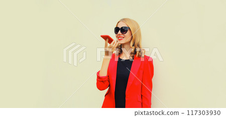 beautiful elegant business woman talking on phone using voice command recorder or takes calling 117303930