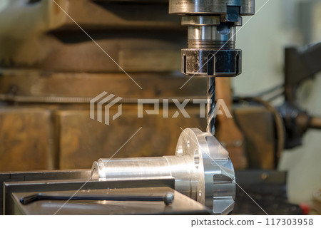 The hole drilling process on NC milling machine with aluminum parts. The hole drilling process on NC milling machine with aluminum parts. 117303958