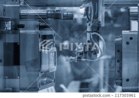 The plastic injection parts gripped by  vacuum robotic system from injection mold. 117303961