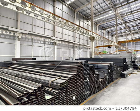 A big warehouse packed with numerous metallic nets and profile A big warehouse packed with numerous metallic nets and profile 117304784