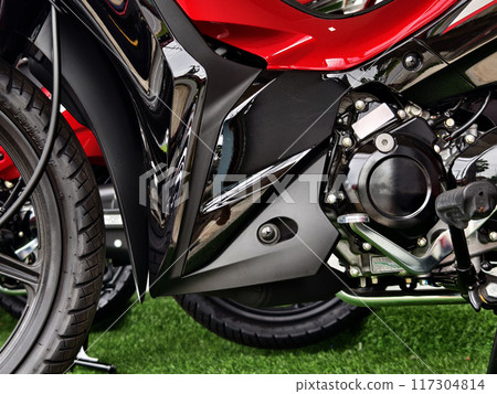 Detailed view of a motorcycle wheels and brakes 117304814