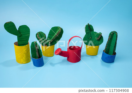 Colorful watering can for flowers and cacti. Paper craft for children. Colorful watering can for flowers and cacti. Paper craft for children. 117304908