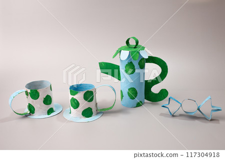 Handmade tea or coffee set crafted from a toilet roll by a child, Toy creation. 117304918