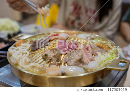 Thai traditional barbecue street food. Pork slice grilled on yakiniku hot pan.Barbecue japanese style 117305059