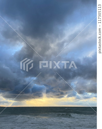 Storm at sea after rain at sunset with clouds 117305113