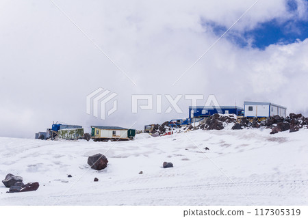 mountain shelters at an altitude of over 4000 meters above sea level on the snowy slope of Mount Elbrus mountain shelters at an altitude of over 4000 meters above sea level on the snowy slope of Mount Elbrus 117305319