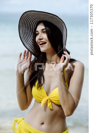 Woman on beach and sand during summer vacation. 117305370