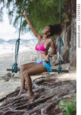 Woman on beach and sand during summer vacation. 117305383