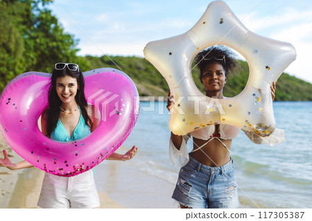 Woman on beach and sand during summer vacation. Woman on beach and sand during summer vacation. 117305387