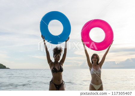 Woman on beach and sand during summer vacation Woman on beach and sand during summer vacation 117305407