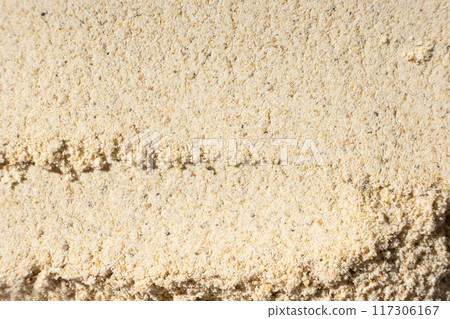 Abstract beige ground ginger background. Creativity in cooking. Abstract beige ground ginger background. Creativity in cooking. 117306167