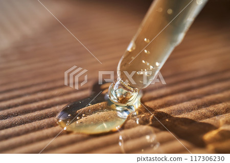 Pipette with serum on a corrugated surface. 117306230